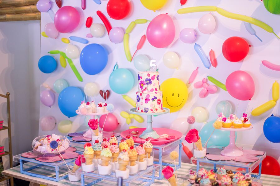 Realistic birthday celebration with food setup and festive dining atmosphere
